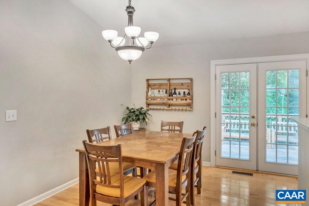 37 Amethyst Road Palmyra, VA 22963 - Photo 7 of 46 a view of a dining room with furniture a chandelier and wooden floor