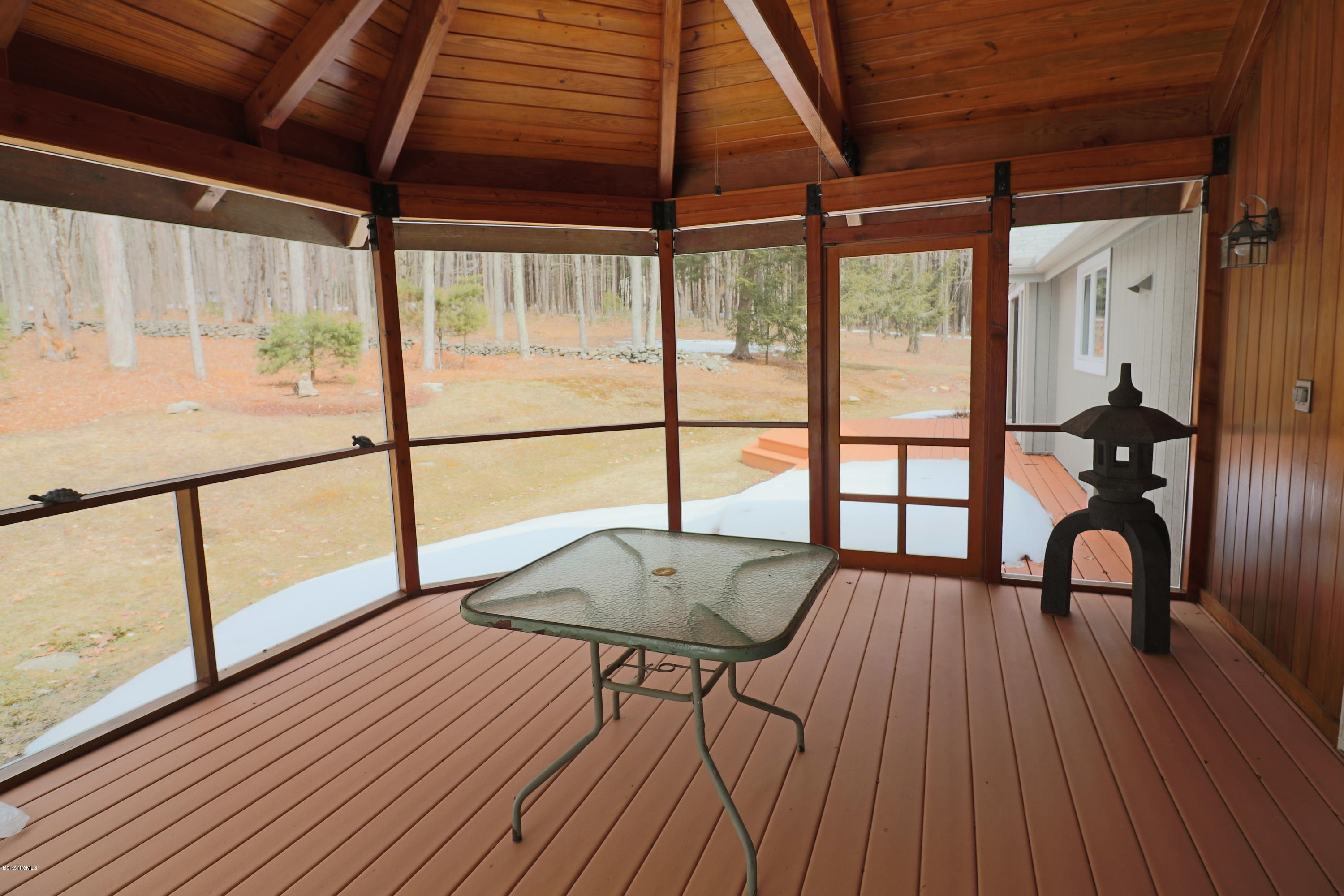 131 Tyringham Road Otis, MA 01253 - Photo 42 of 46 a view of a room with wooden floor and furniture