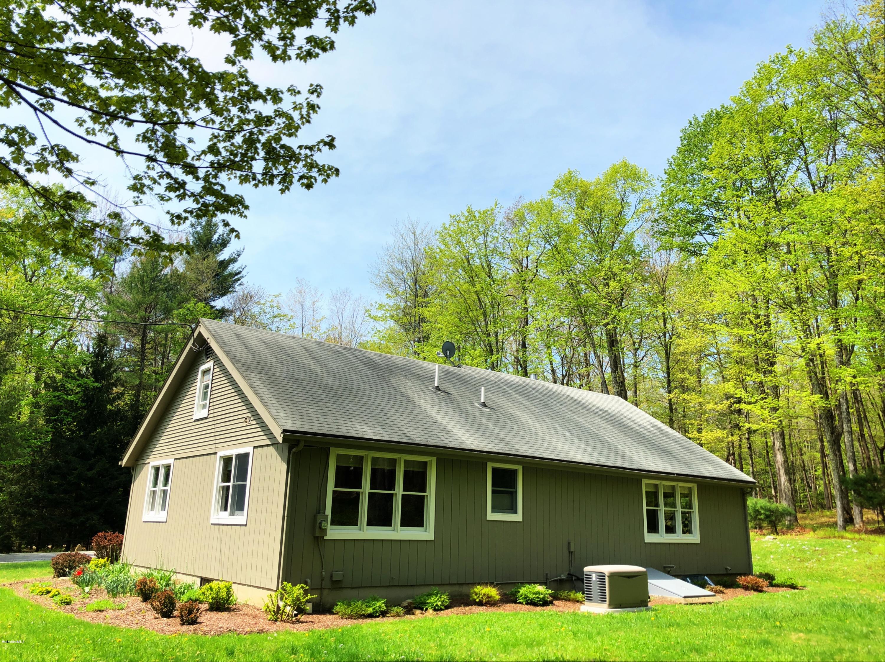 131 Tyringham Road Otis, MA 01253 - Photo 46 of 46 a front view of a house with garden