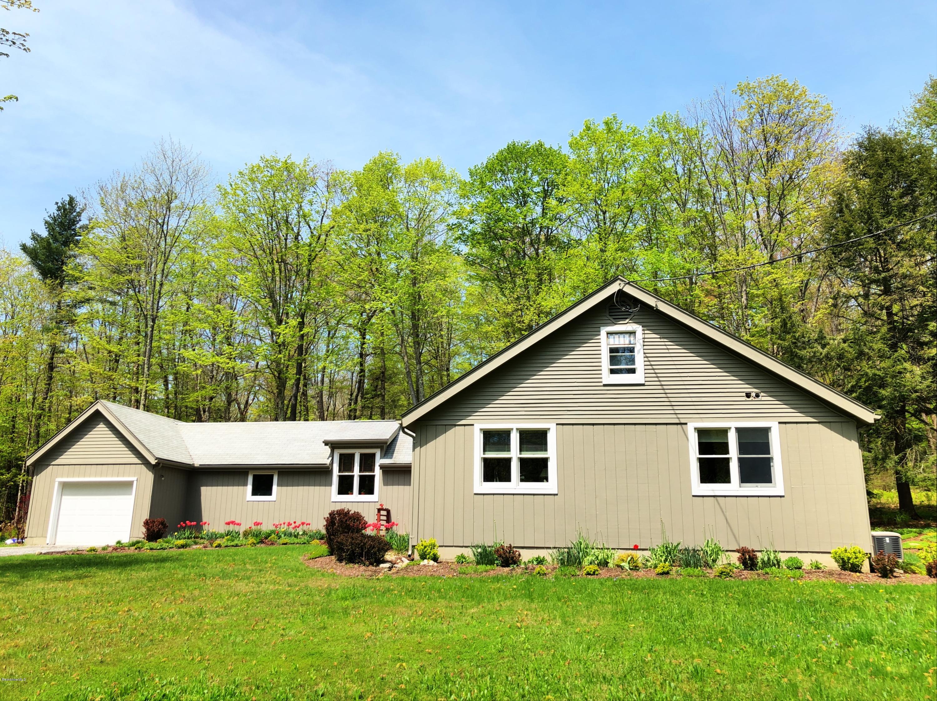 131 Tyringham Road Otis, MA 01253 - Photo 6 of 46 a front view of house with yard and green space