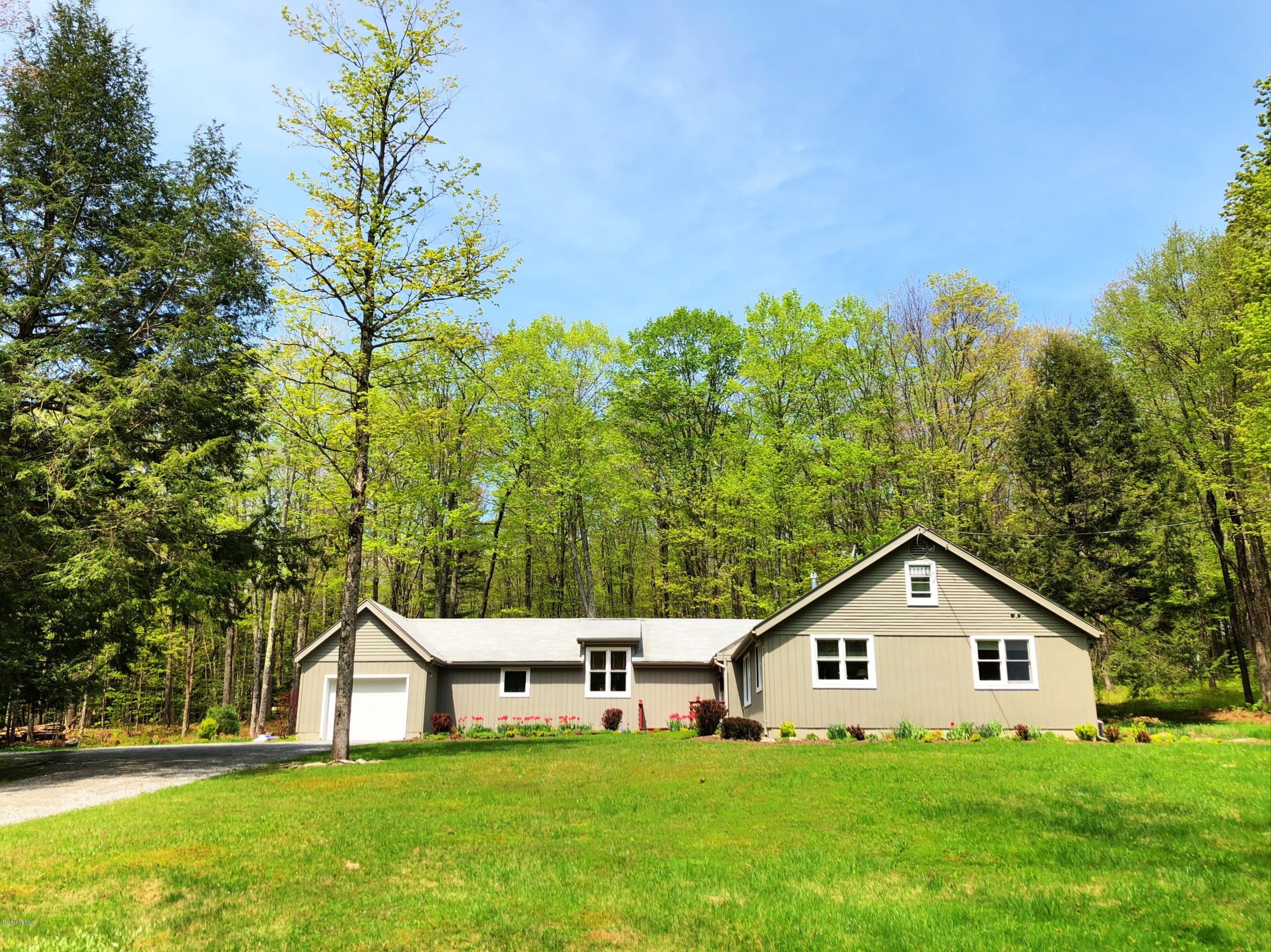 131 Tyringham Road Otis, MA 01253 - Photo 7 of 46 a view of a house with a yard