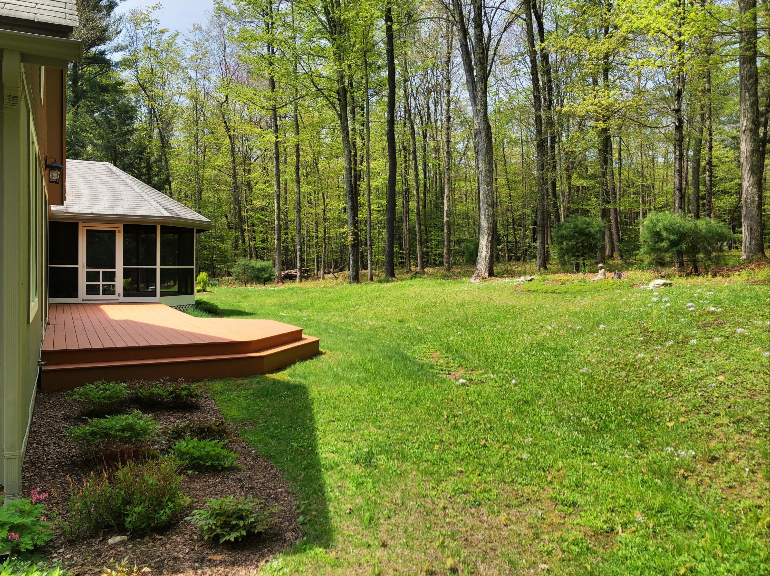131 Tyringham Road Otis, MA 01253 - Photo 8 of 46 a house view with a garden space