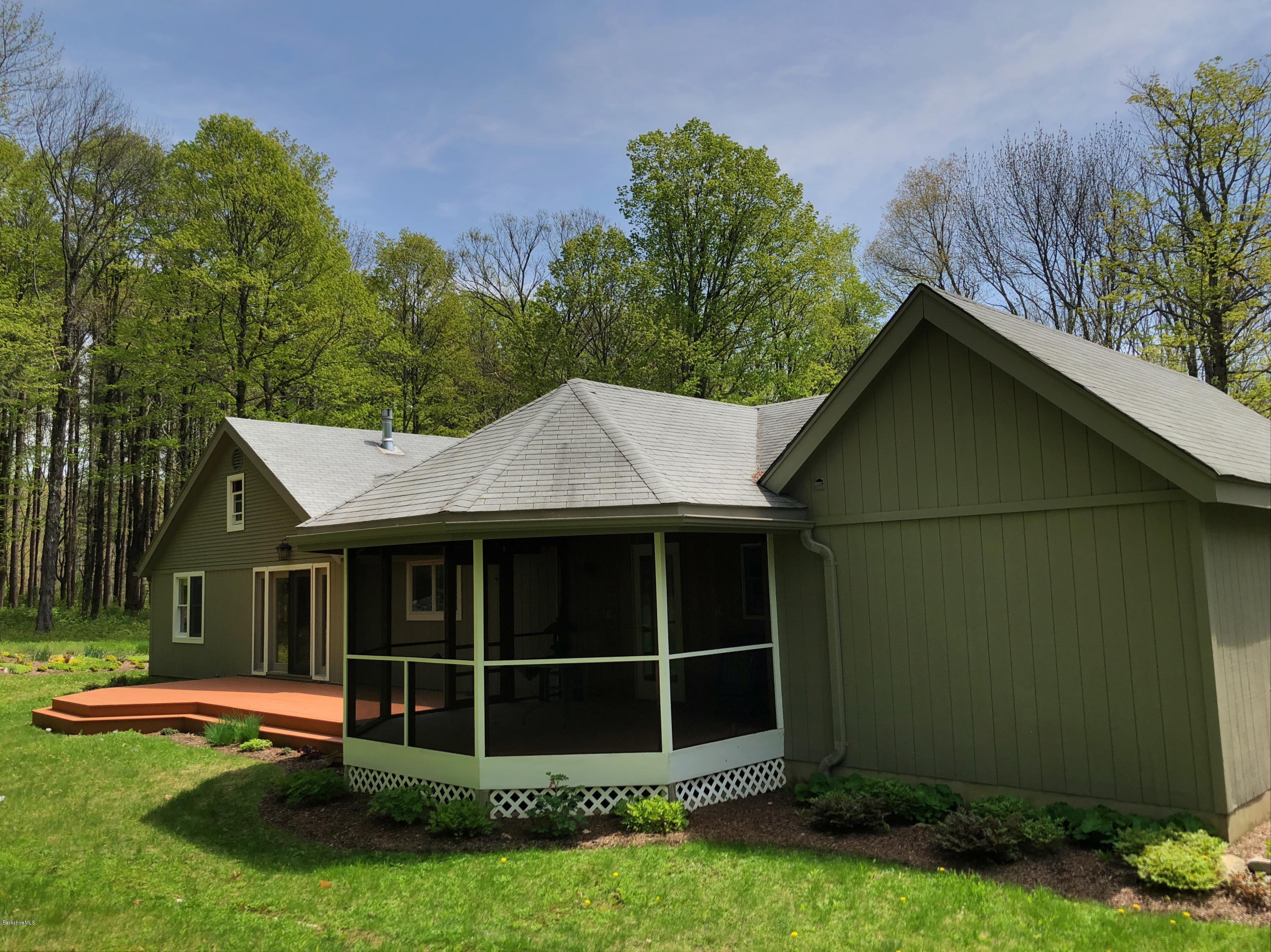 131 Tyringham Road Otis, MA 01253 - Photo 9 of 46 a view of a house with a yard plants and large tree