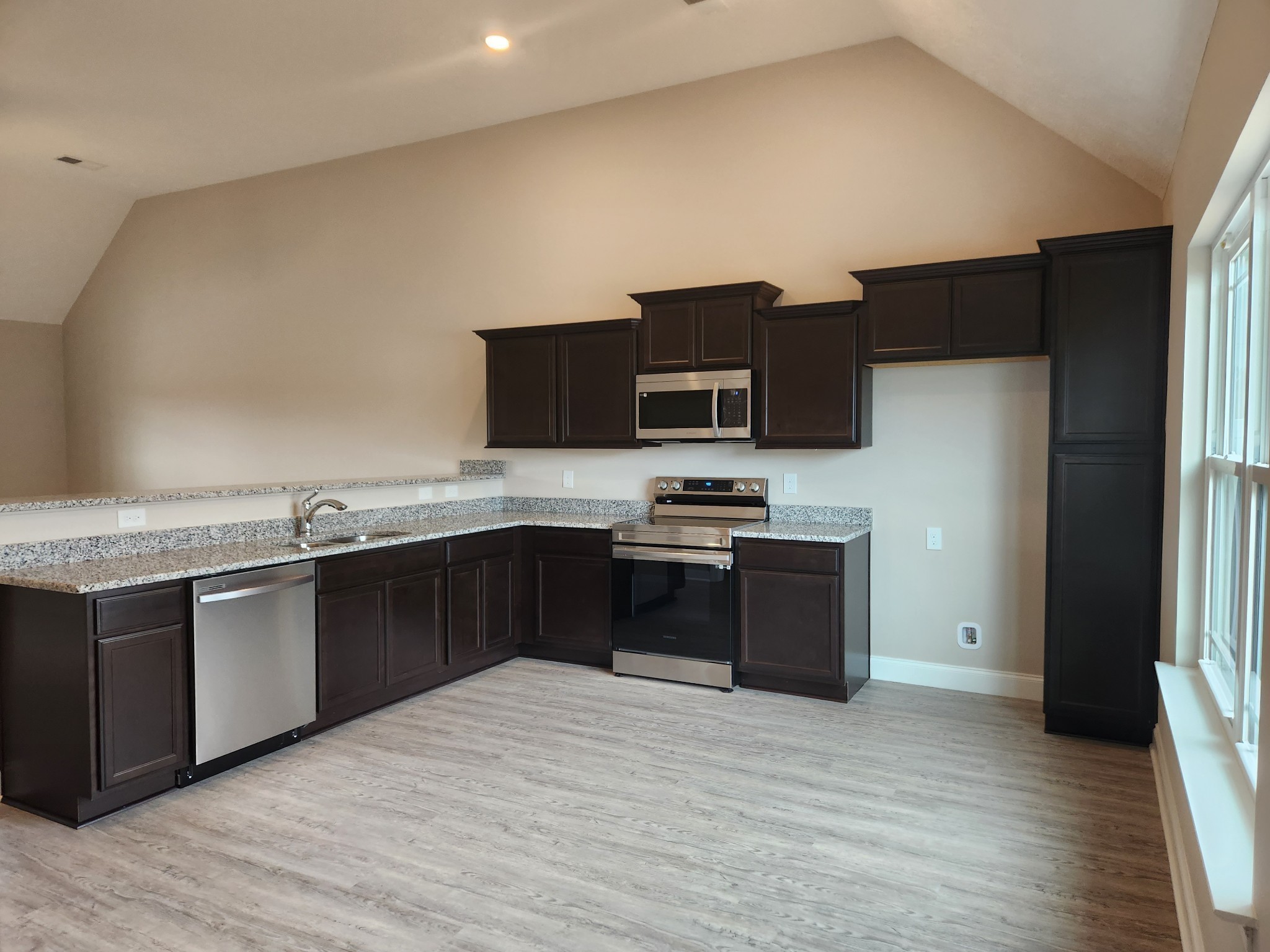 2843 Upstream Road Christiana, TN 37037 - Photo 11 of 64 a kitchen with stainless steel appliances kitchen island granite countertop a refrigerator and a stove top oven