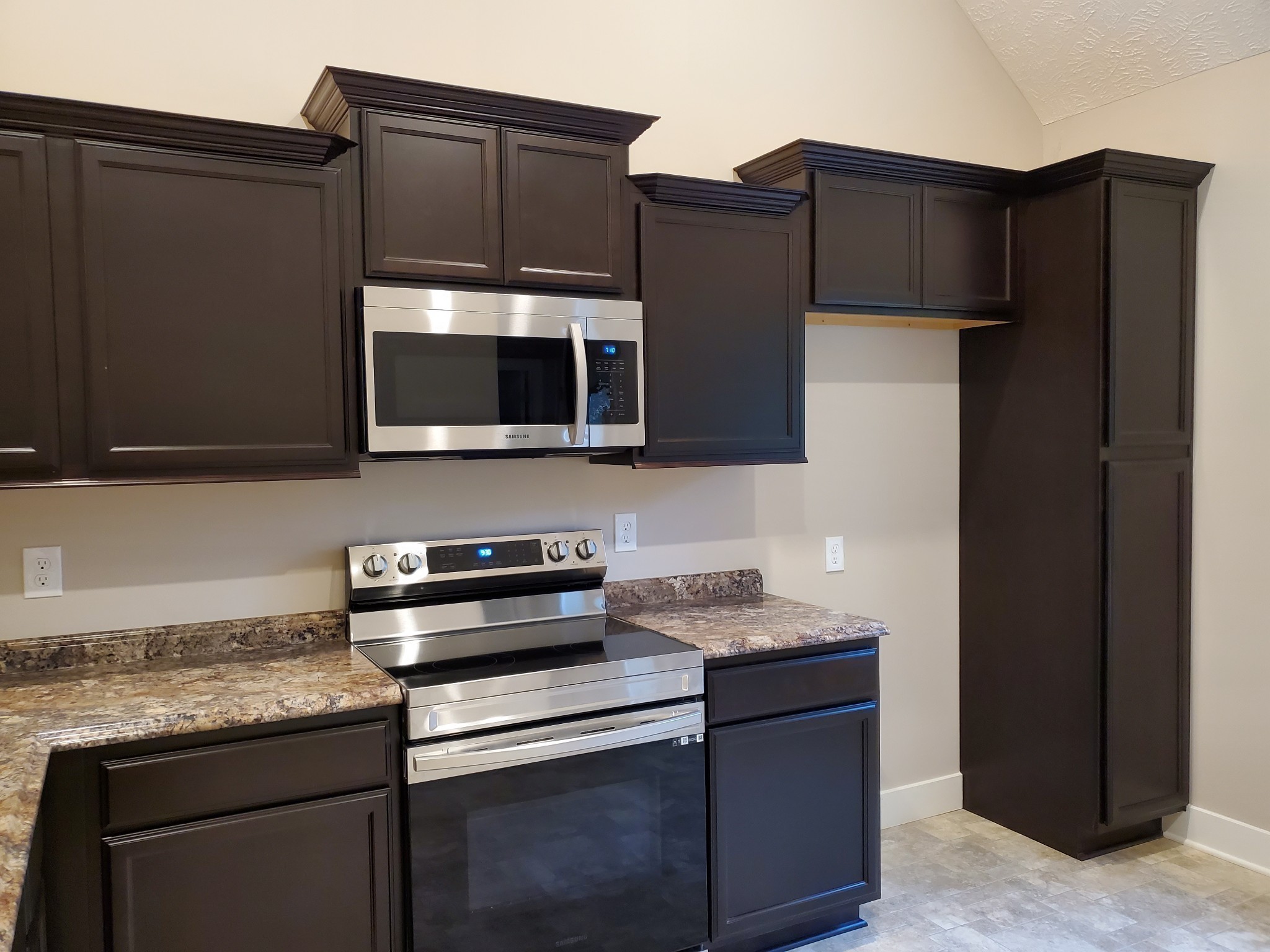 2843 Upstream Road Christiana, TN 37037 - Photo 7 of 64 a kitchen with stainless steel appliances wooden cabinets and a granite counter top