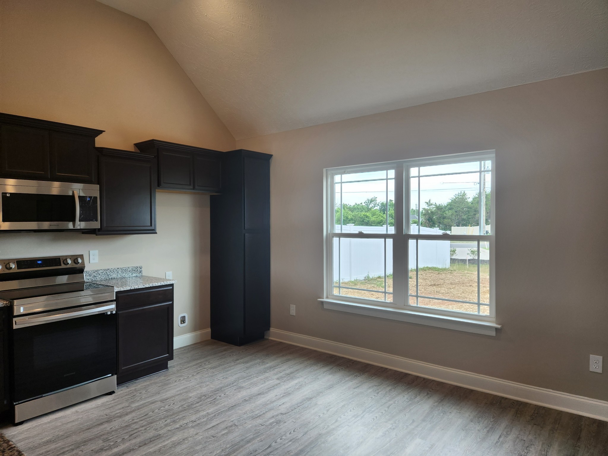 2843 Upstream Road Christiana, TN 37037 - Photo 8 of 64 a kitchen with stainless steel appliances a large window a sink and a microwave