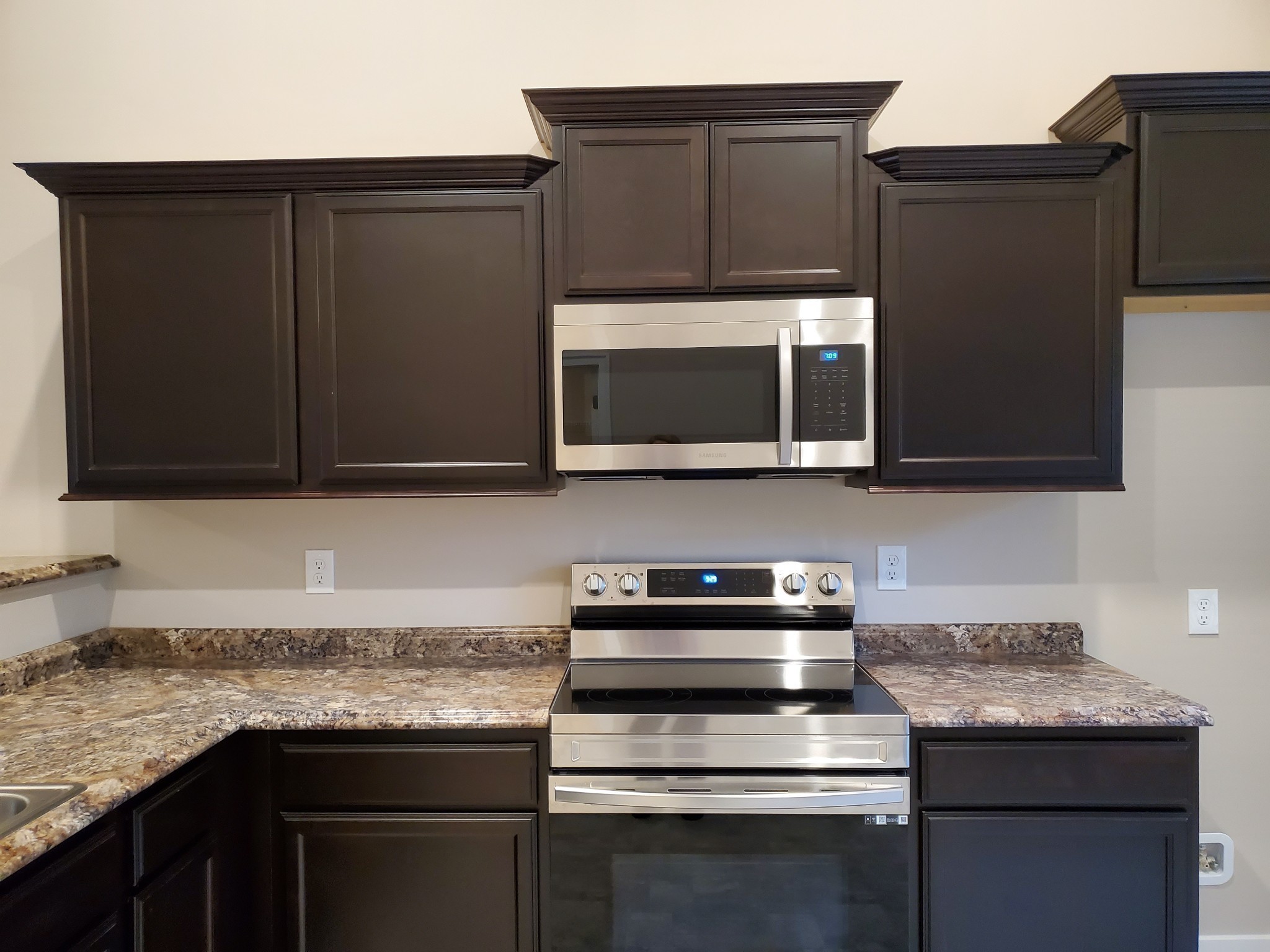 2843 Upstream Road Christiana, TN 37037 - Photo 9 of 64 a kitchen with stainless steel appliances granite countertop a stove microwave and oven