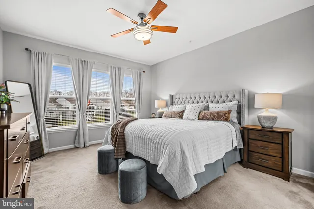 a bedroom with a bed and lamp