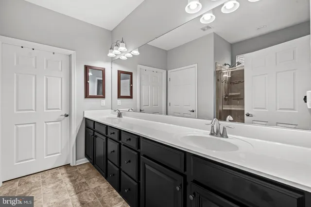 a utility room with sink dryer and washer