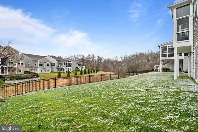 a view of a patio with a table and chairs