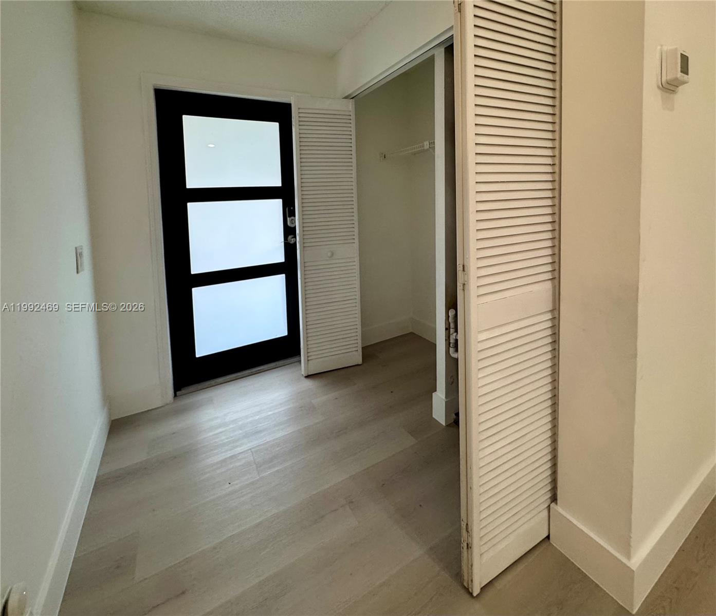 2159 Baton Rouge, Unit 2159 Weston, FL 33326 - Photo 11 of 49 a view of front door with wooden floor