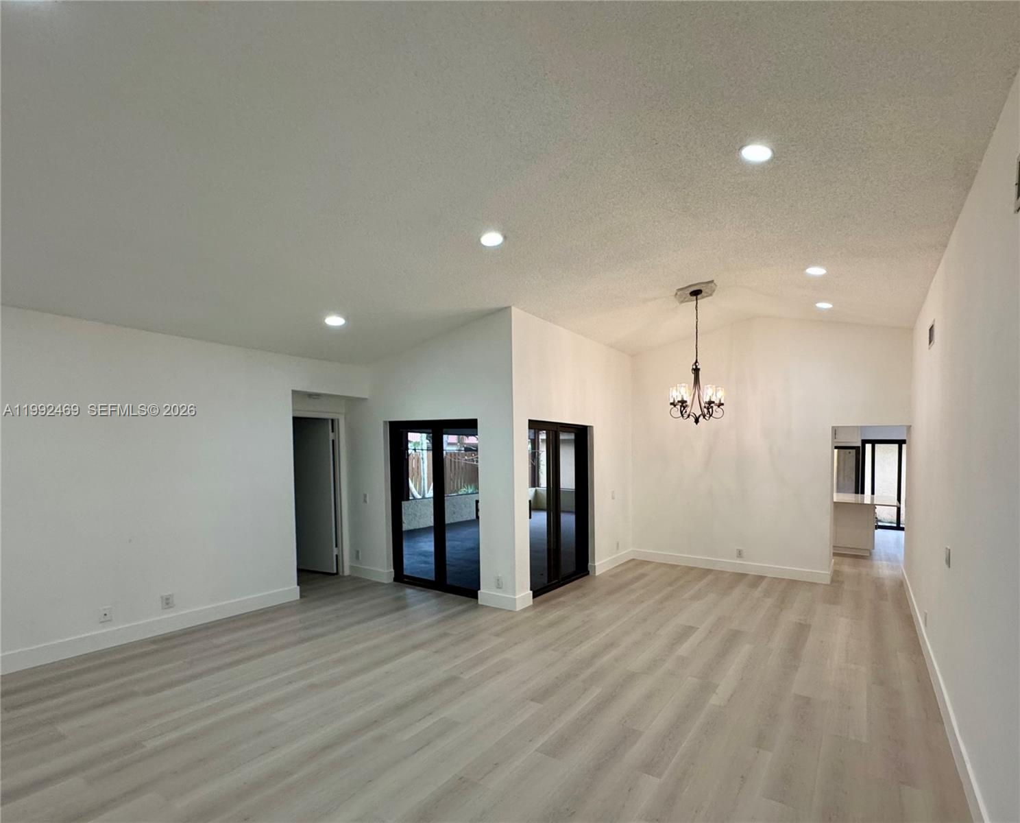 2159 Baton Rouge, Unit 2159 Weston, FL 33326 - Photo 13 of 49 a view of an empty room with wooden floor