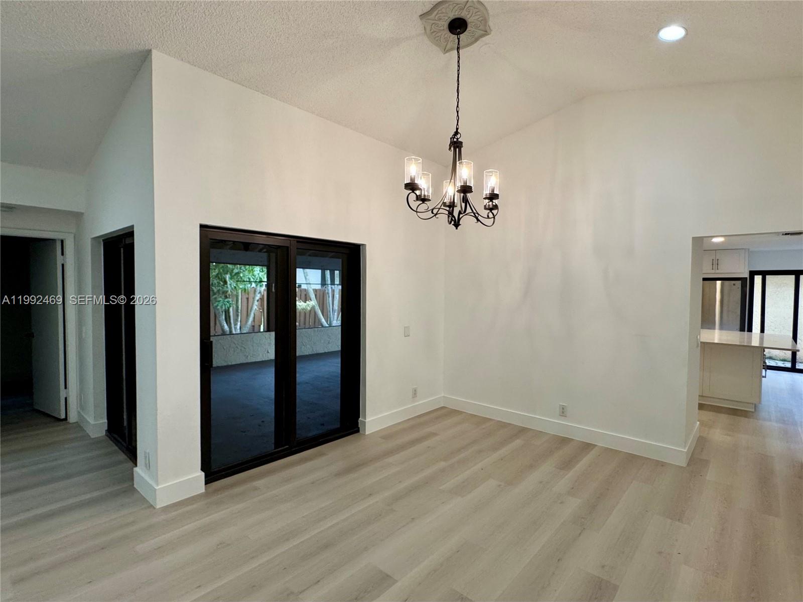 2159 Baton Rouge, Unit 2159 Weston, FL 33326 - Photo 14 of 49 a view of an empty room with window and wooden floor