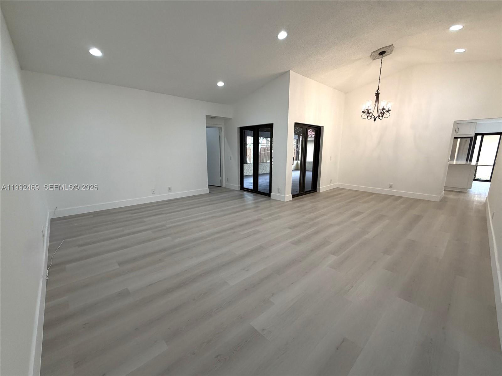 2159 Baton Rouge, Unit 2159 Weston, FL 33326 - Photo 15 of 49 an empty room with wooden floor and windows