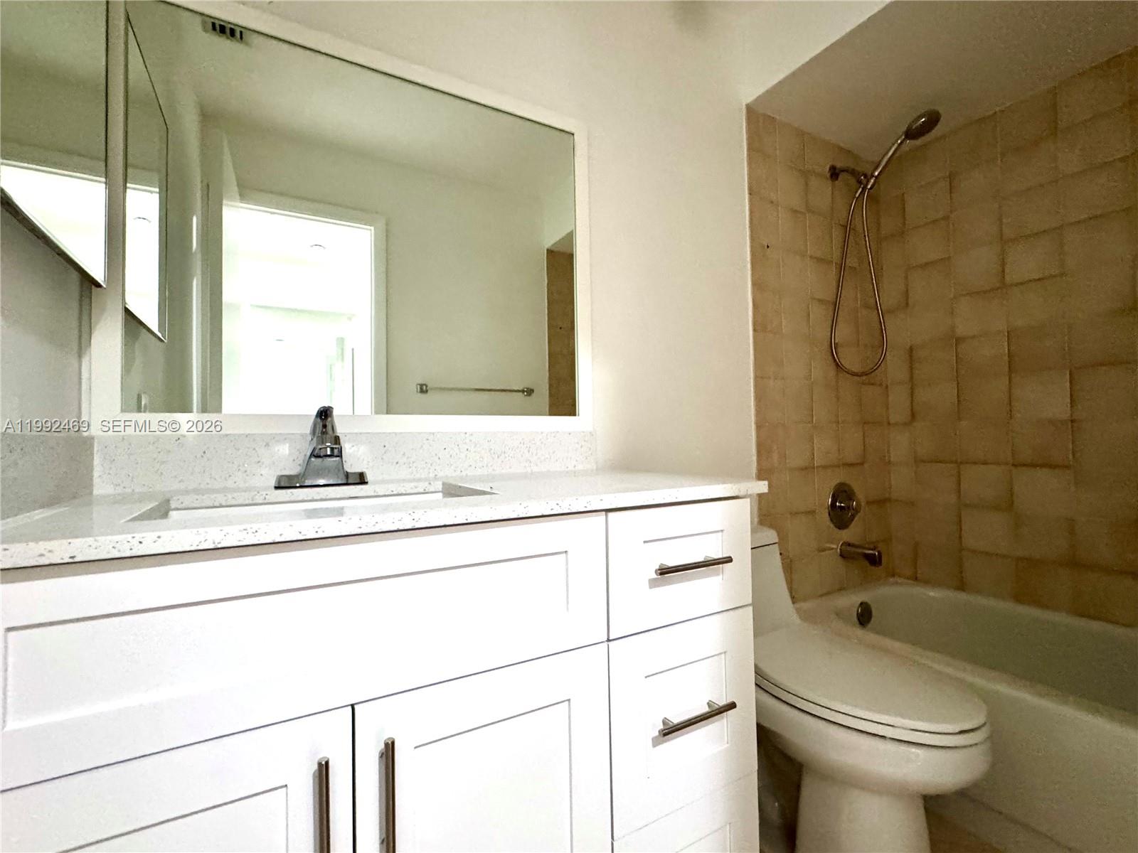 2159 Baton Rouge, Unit 2159 Weston, FL 33326 - Photo 32 of 49 a bathroom with a sink a toilet and shower