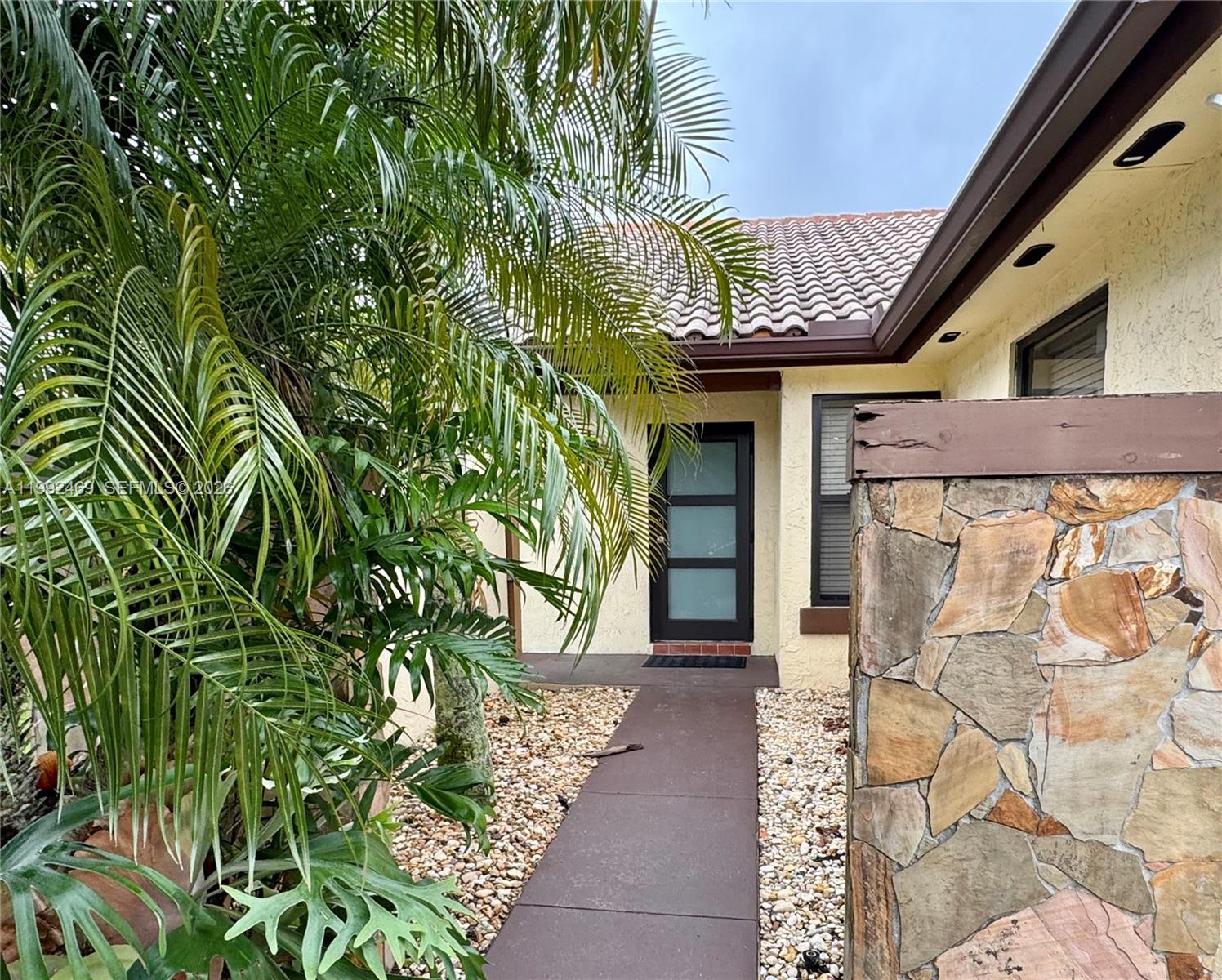 2159 Baton Rouge, Unit 2159 Weston, FL 33326 - Photo 5 of 49 a porch with seating space and yard in the back