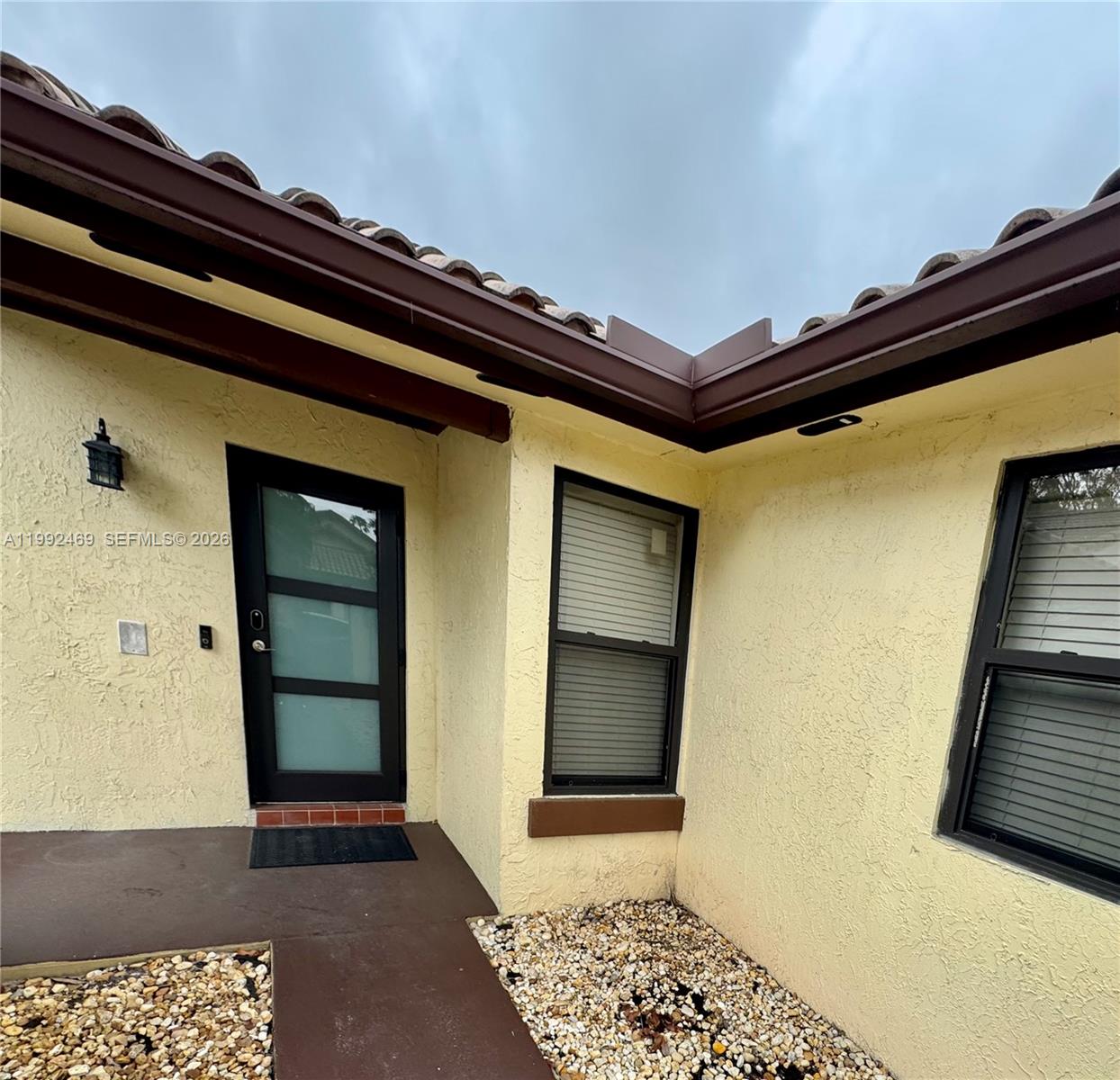 2159 Baton Rouge, Unit 2159 Weston, FL 33326 - Photo 8 of 49 a view of a hallway with wooden floor and staircase