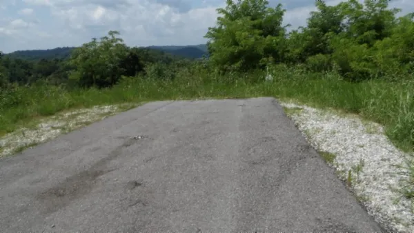 a view of a lake with a yard
