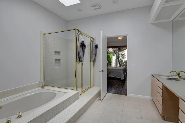 a spacious bathroom with a double vanity sink double and mirror