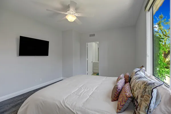 a bathroom with a sink vanity and shower