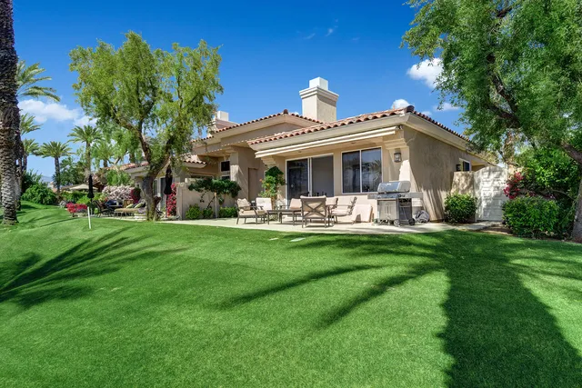 a view of a building with chairs and tables