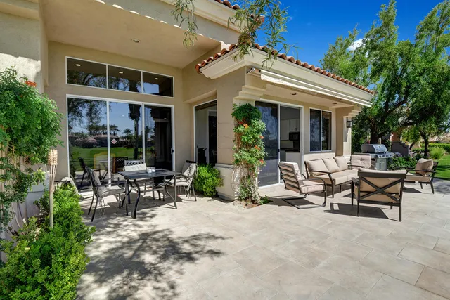 a view of a park with lawn chairs