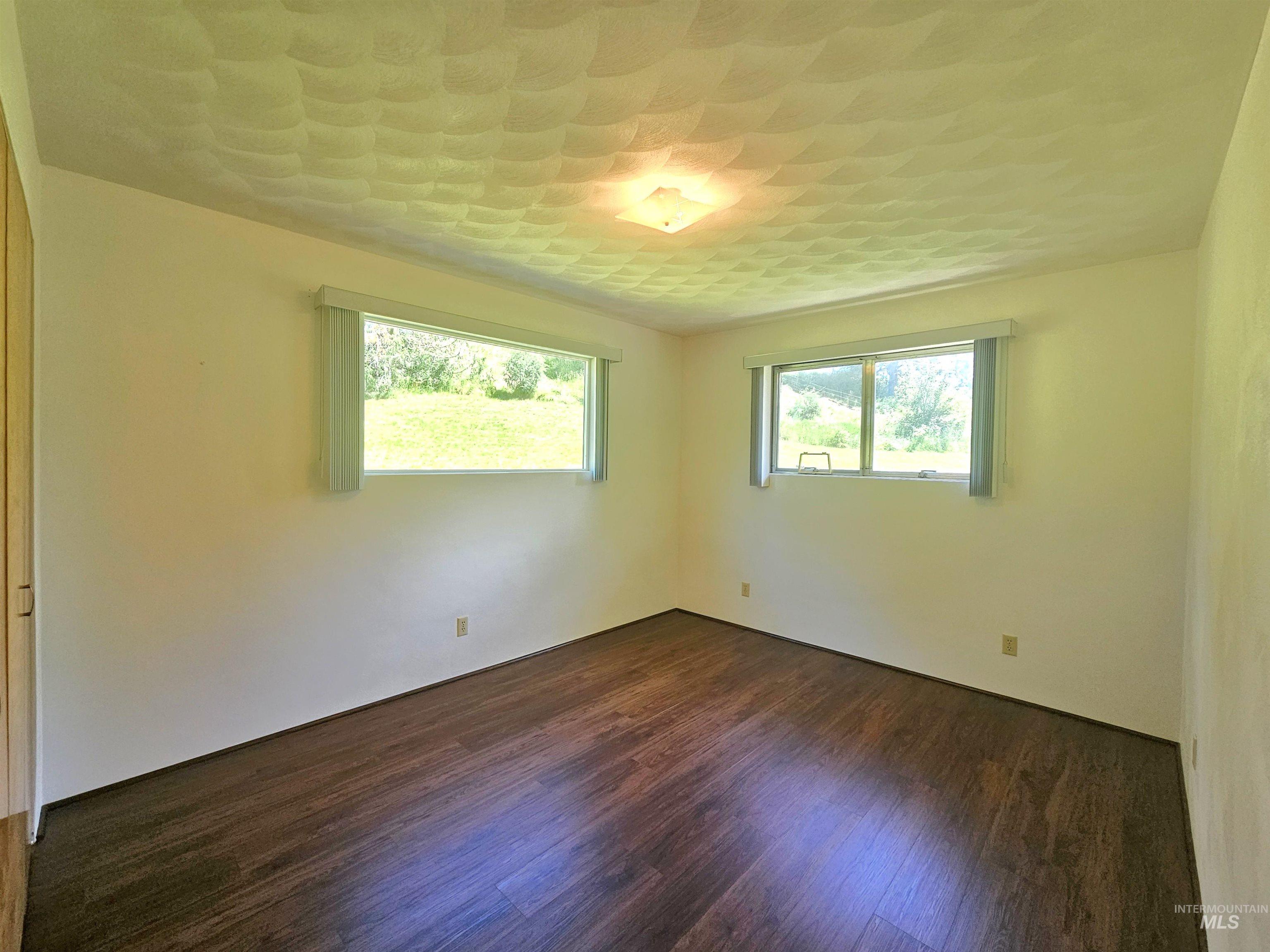 29865 Mission Creek Road Culdesac, ID 83524 - Photo 23 of 43 Hardwood-finish flooring complements the neutral wall tones