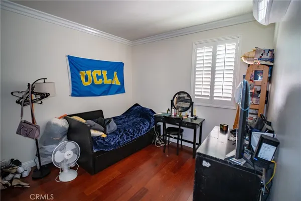 a bedroom with furniture and a window