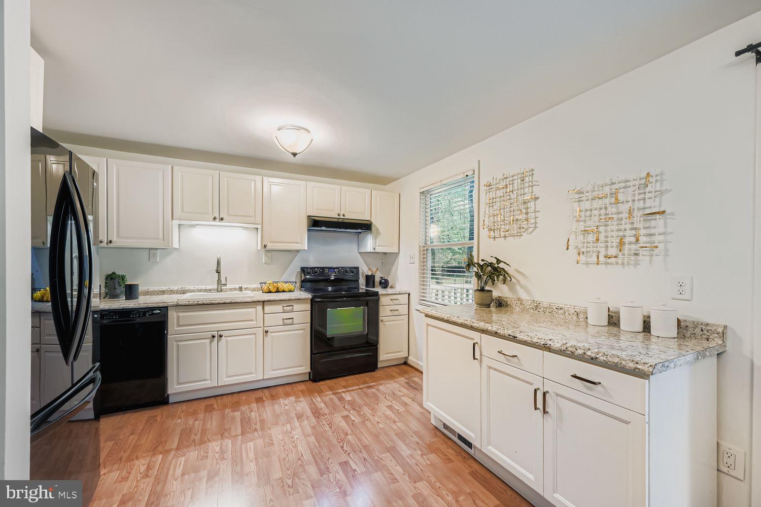 15604 Wembrough Street Silver Spring, MD 20905 - Photo 12 of 33 Modern kitchen with sleek cabinetry.