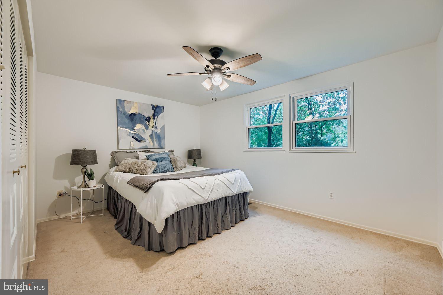 15604 Wembrough Street Silver Spring, MD 20905 - Photo 15 of 33 Serene bedroom with natural light and charm.