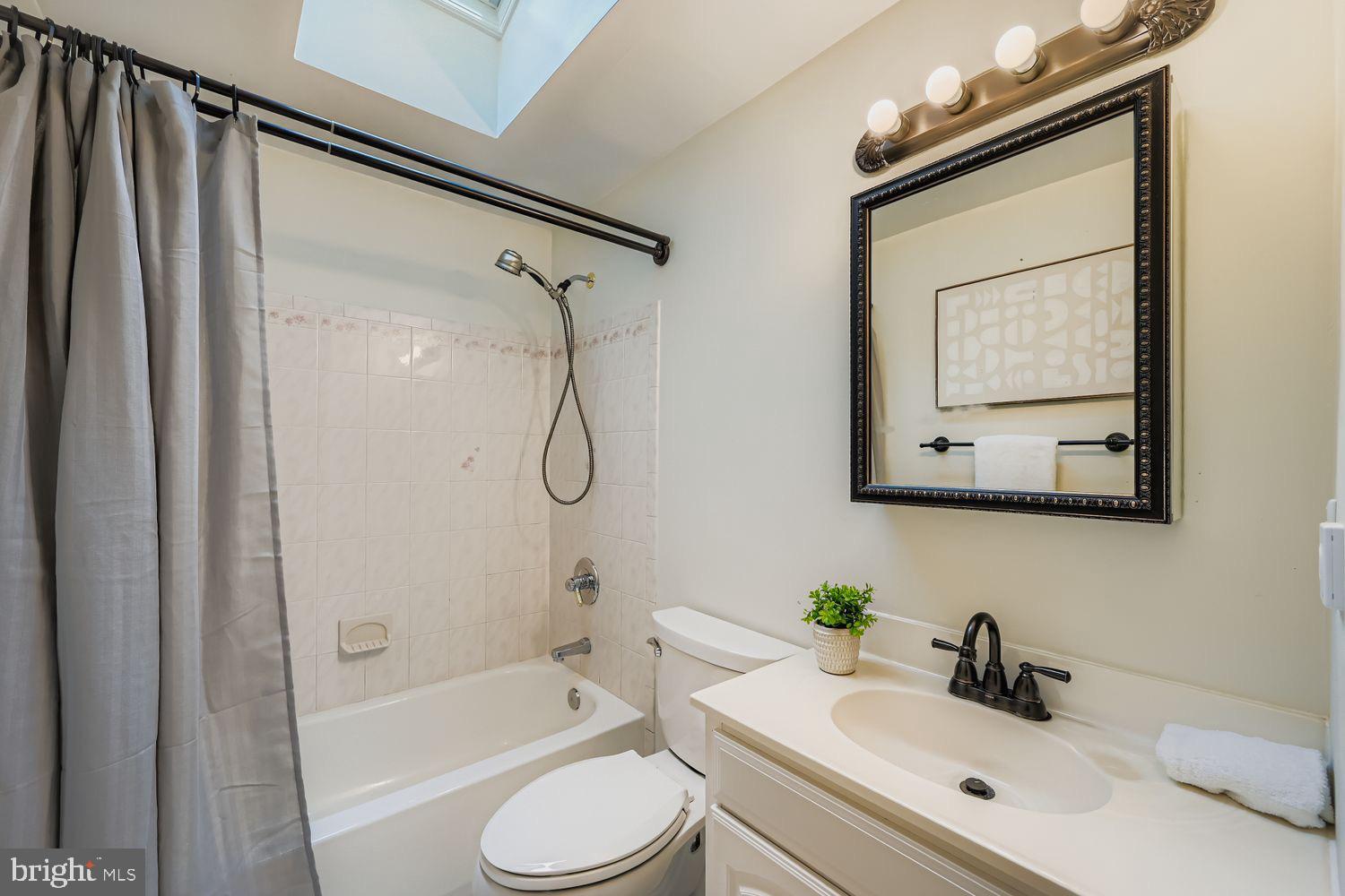 15604 Wembrough Street Silver Spring, MD 20905 - Photo 17 of 33 Bright and airy bathroom with modern touches.