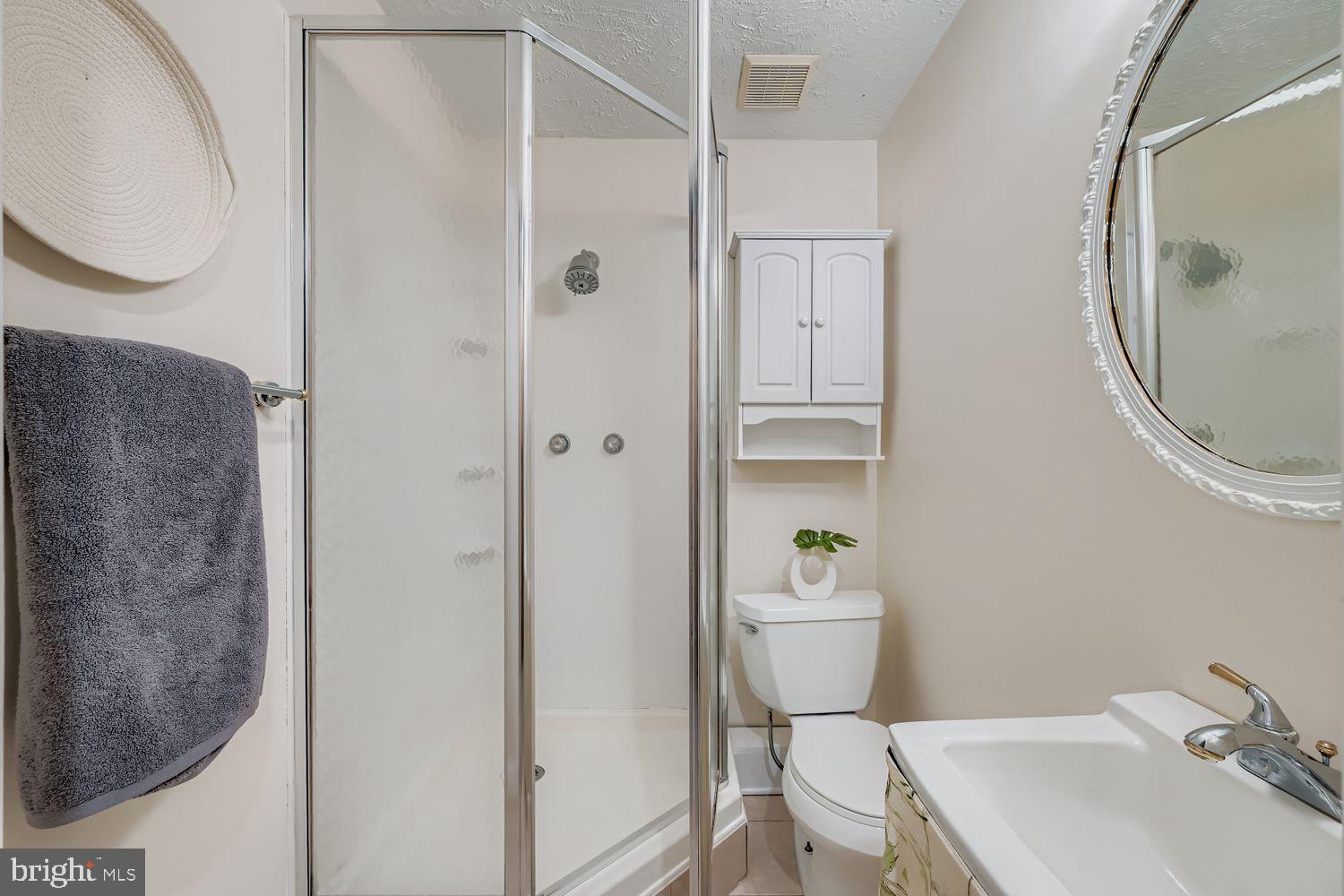 15604 Wembrough Street Silver Spring, MD 20905 - Photo 23 of 33 Modern bathroom with sleek fixtures.