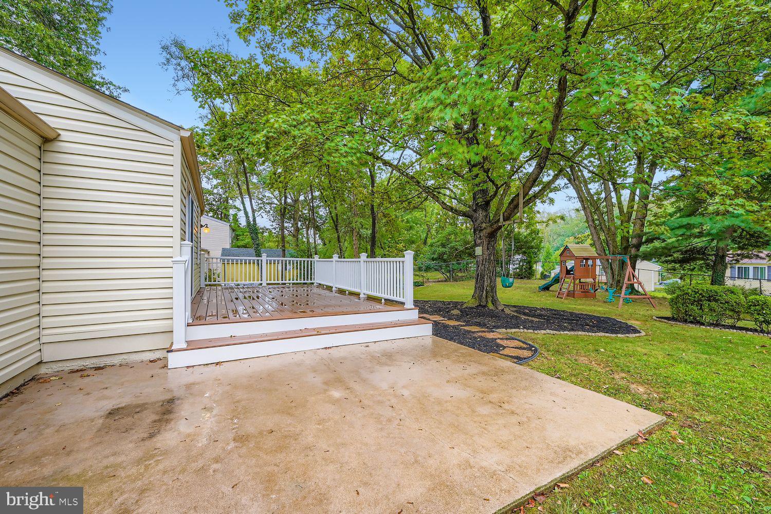 15604 Wembrough Street Silver Spring, MD 20905 - Photo 27 of 33 Serene backyard retreat with lush greenery.