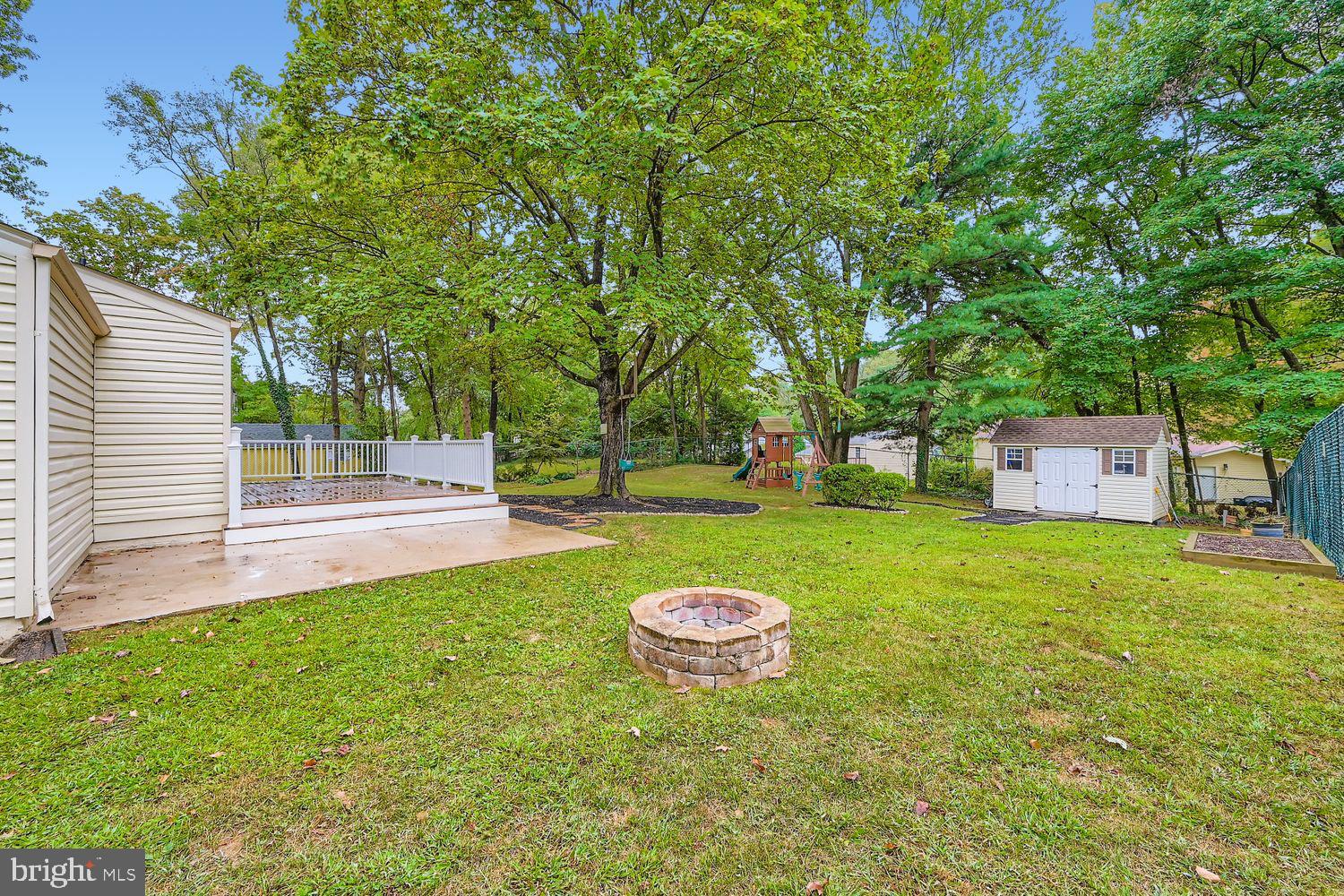 15604 Wembrough Street Silver Spring, MD 20905 - Photo 28 of 33 Spacious backyard oasis with fire pit charm.
