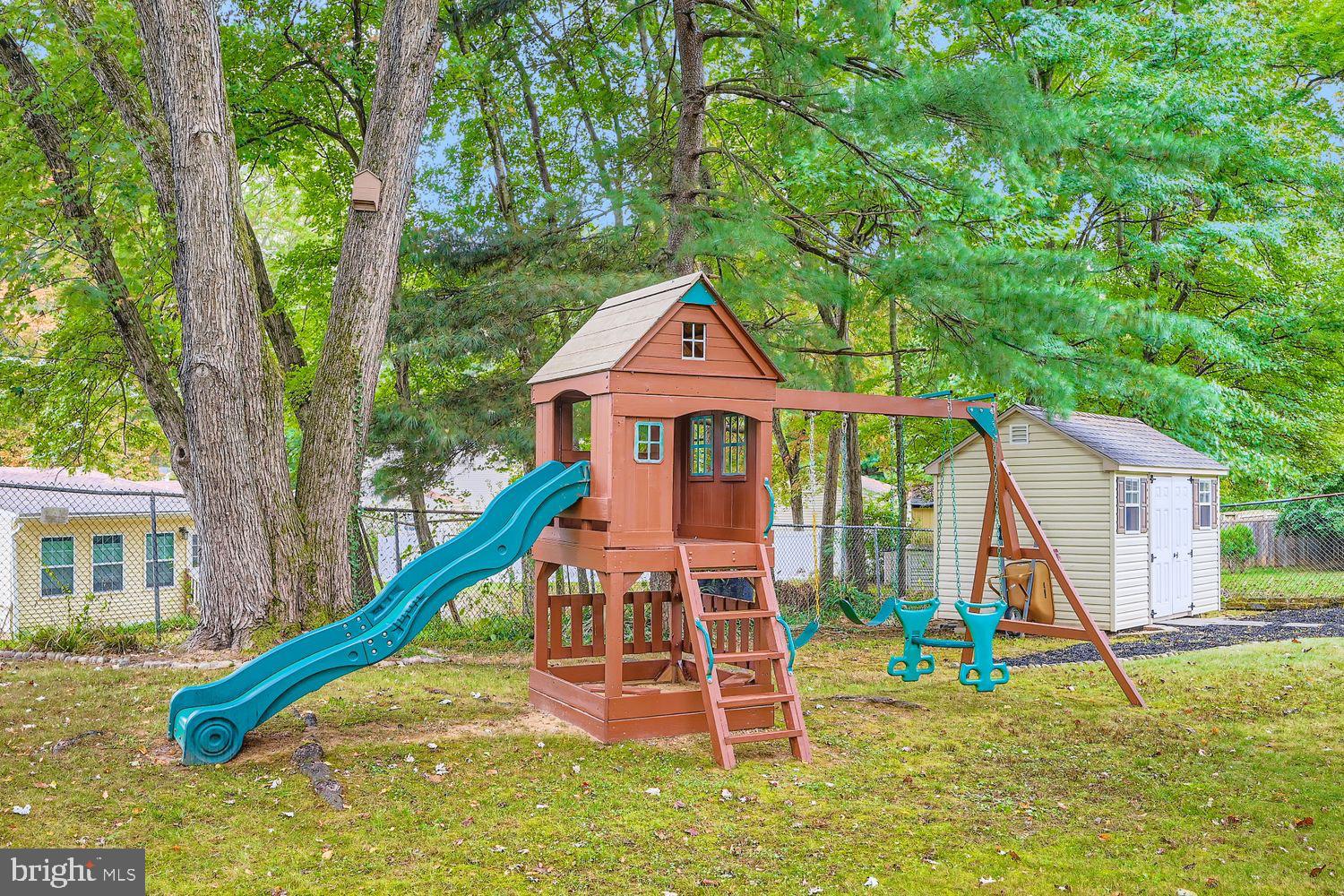 15604 Wembrough Street Silver Spring, MD 20905 - Photo 33 of 33 Charming playset nestled in nature's embrace.