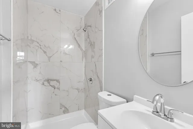 a bathroom with a sink and shower