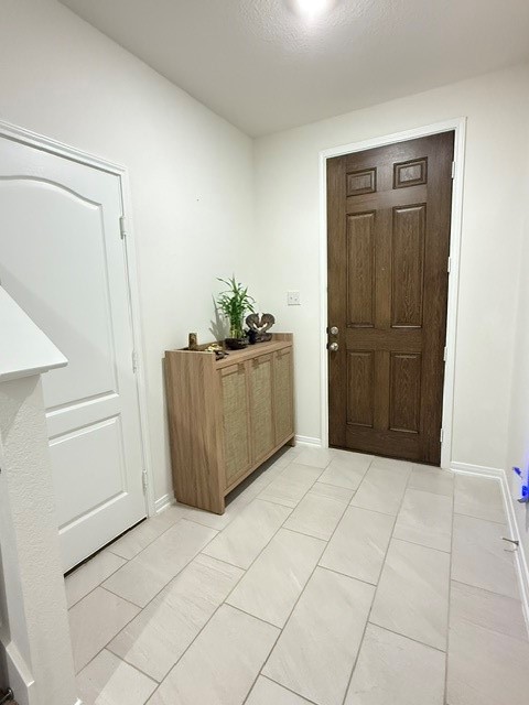 6415 Kentfield Drive Rosharon, TX 77583 - Photo 5 of 21 Welcoming foyer with large tile flooring and convenient entry storage.