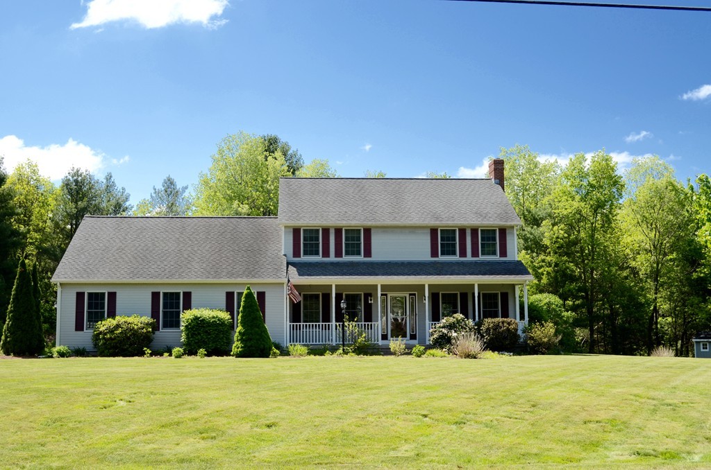66 Zuell Hill Road Monson, MA 01057 - Photo 1 of 25 a front view of a house with a yard