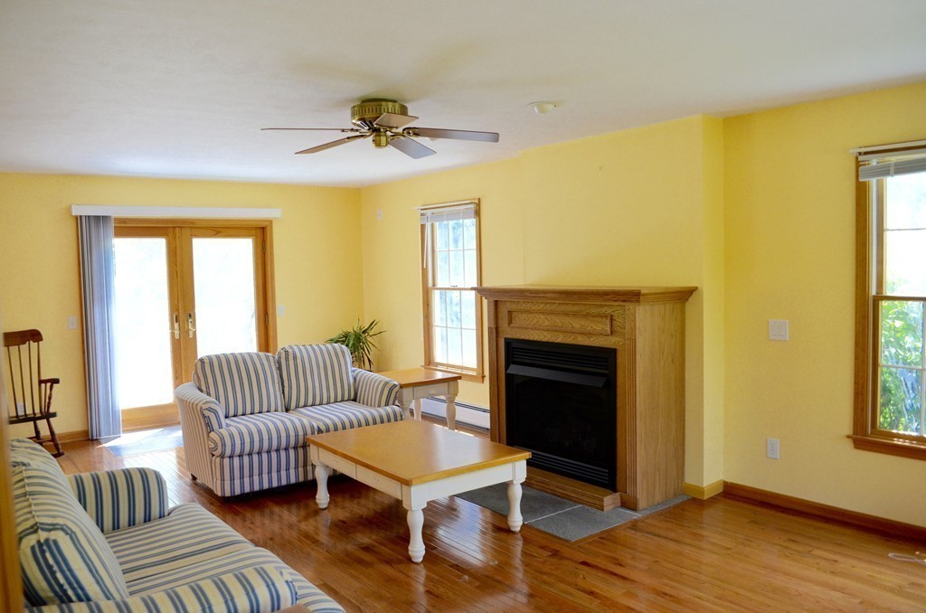 66 Zuell Hill Road Monson, MA 01057 - Photo 12 of 25 a living room with furniture and a fireplace