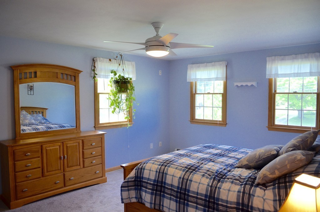 66 Zuell Hill Road Monson, MA 01057 - Photo 14 of 25 a bedroom with a bed and a dresser in it