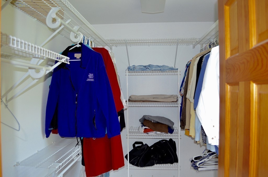 66 Zuell Hill Road Monson, MA 01057 - Photo 16 of 25 a view of walk in closet with clothes and shoes