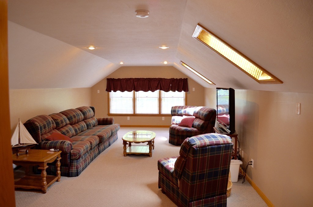 66 Zuell Hill Road Monson, MA 01057 - Photo 21 of 25 a living room with furniture and a large window
