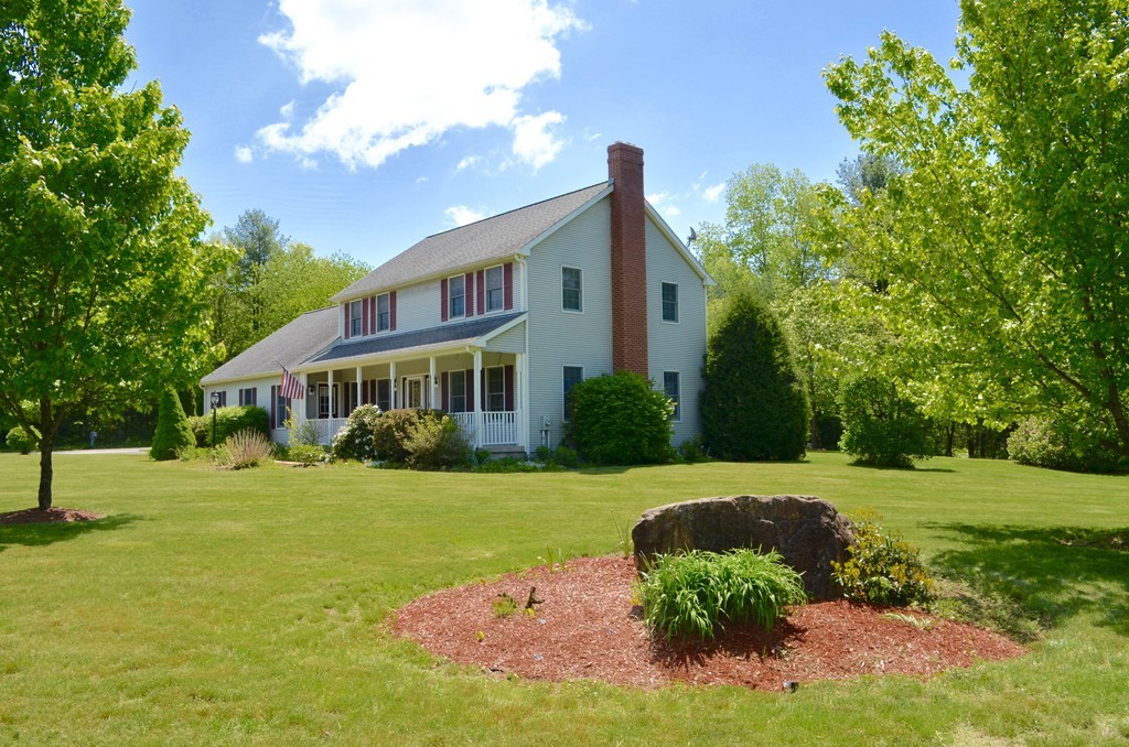 66 Zuell Hill Road Monson, MA 01057 - Photo 3 of 25 a front view of a house with a yard