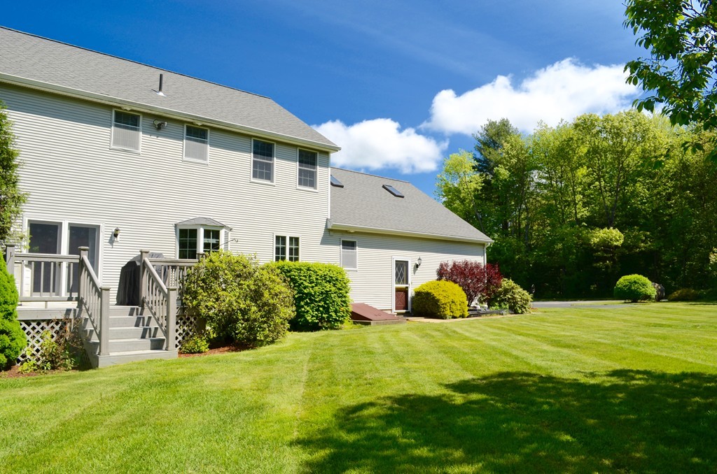 66 Zuell Hill Road Monson, MA 01057 - Photo 4 of 25 a front view of house with yard and green space