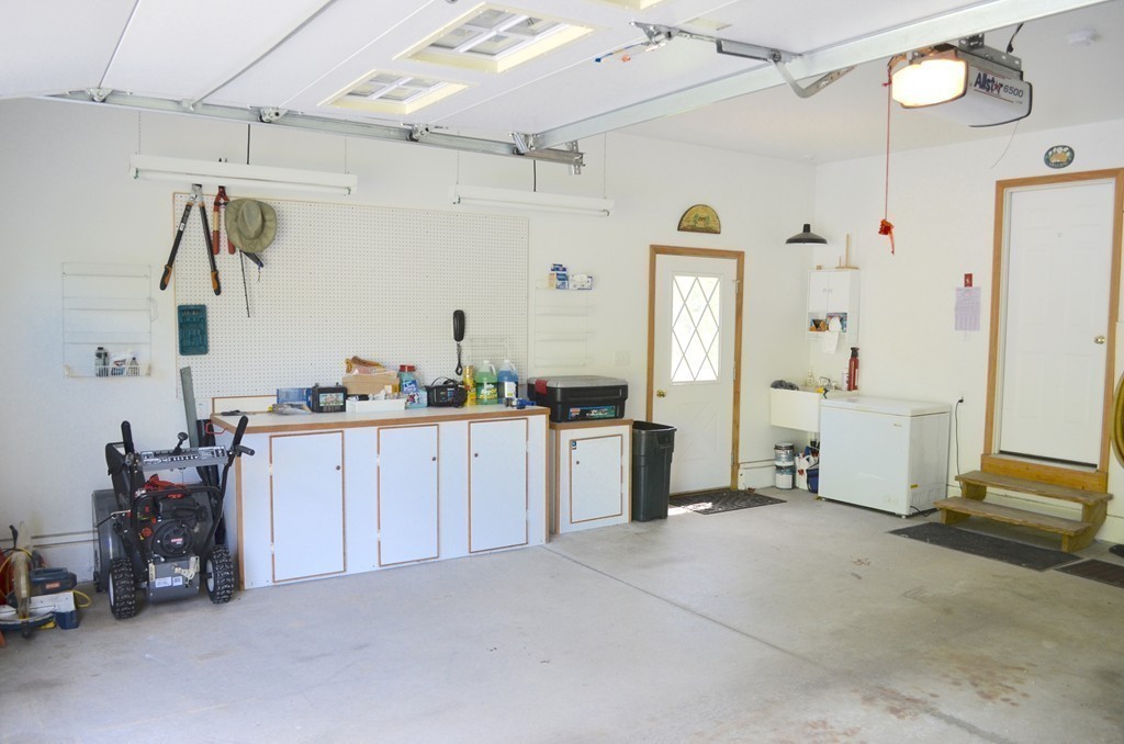 66 Zuell Hill Road Monson, MA 01057 - Photo 7 of 25 a view of a kitchen with fridge and workspace
