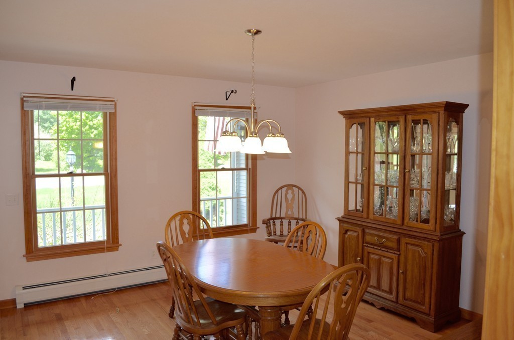 66 Zuell Hill Road Monson, MA 01057 - Photo 10 of 25 a view of a dining room with furniture window and outside view