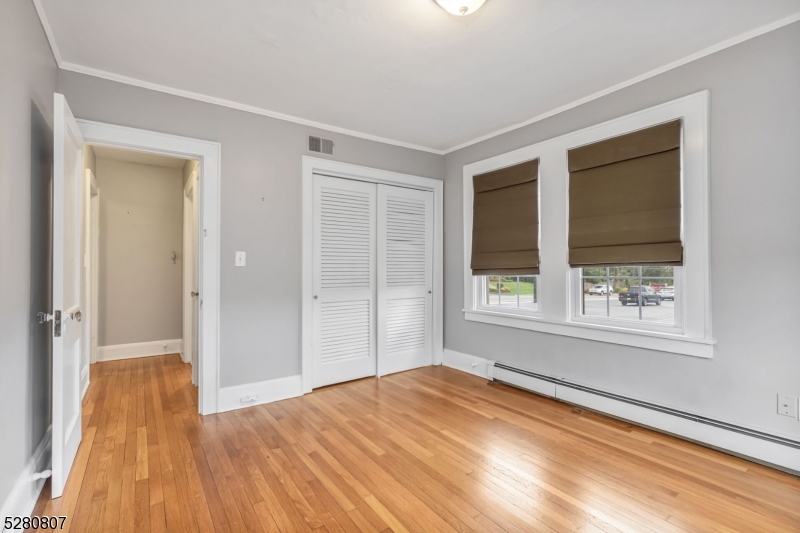 153 Stirling Road Watchung, NJ 07069 - Photo 15 of 31 a view of empty room with wooden floor and fan