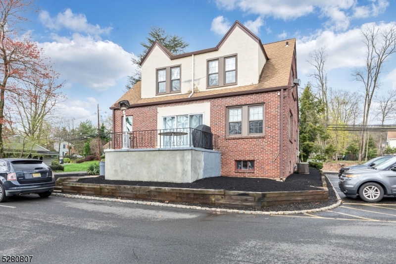 153 Stirling Road Watchung, NJ 07069 - Photo 2 of 31 a view of a car parked in front of a house