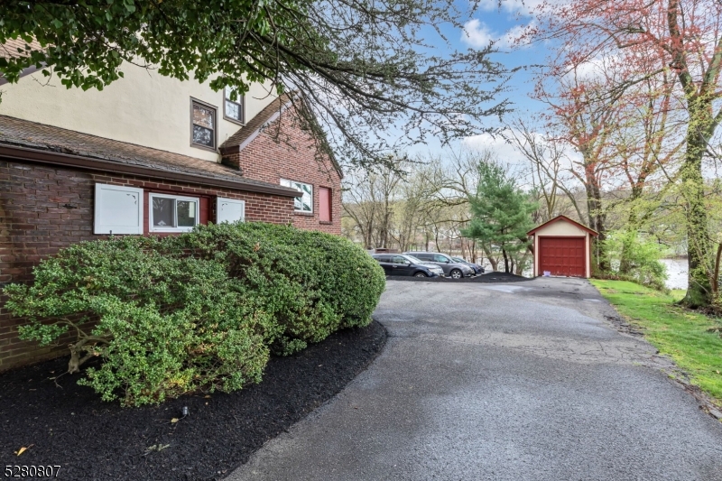 153 Stirling Road Watchung, NJ 07069 - Photo 5 of 31 a front view of a house with a yard and garage