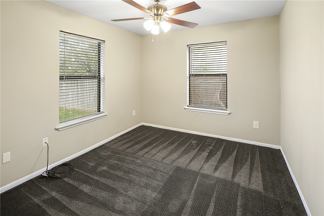 314 Moss Street Bryan, TX 77803 - Photo 10 of 18 a view of an empty room with wooden floor and a window